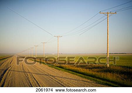 Picture - Gravelled Road At Sunset In Rural Saskatchewan, Canada. Fotosearch