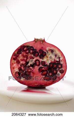 Half A Pomegranate On A White Plate View Large Photo Image Stock Photo - Half A Pomegranate On A White Plate. Fotosearch
