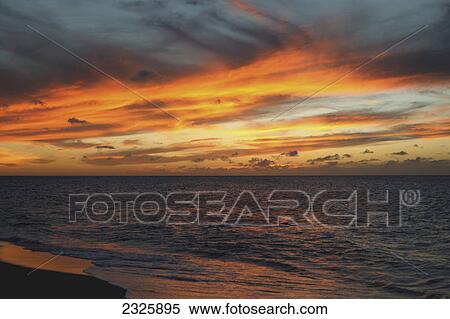 Hawaii, Oahu, North shore dramatic sunset over the ocean. View Large Photo Image Stock Photography - Hawaii, Oahu, North shore dramatic sunset over the ocean.. Fotosearch