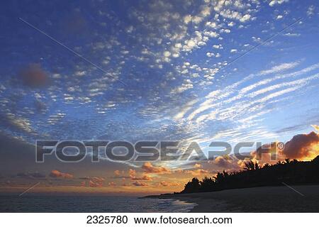 Hawaii, Oahu, North shore sunrise over the ocean. View Large Photo Image Stock Image - Hawaii, Oahu, North shore sunrise over the ocean.. Fotosearch