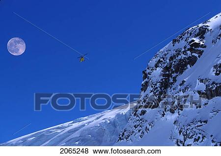 Helicopter In Mountains, Whistler, Bc, Canada View Large Photo Image Stock Photo - Helicopter In Mountains, Whistler, Bc, Canada. Fotosearch