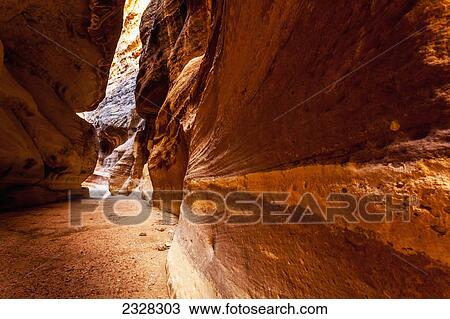 High rock walls and a narrow path at the entrance to an ancient city; Petra jordan View Large Photo Image Stock Image - High rock walls and a narrow path at the entrance to an ancient city; Petra jordan. Fotosearch