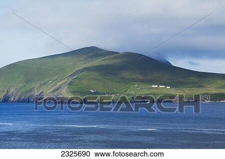 Stock Image - Houses on a hillside on the blasket islands on blasket sound; County kerry ireland. Fotosearch