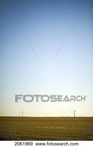 Stock Photo - Hydro Electric Power Lines Across Field Are Dwarfed By Prairie Sky, Saskatchewan, Canada. Fotosearch