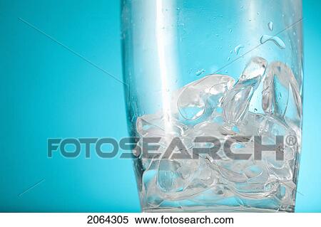 Stock Photography - Ice Chips In Bottom Of Clear Glass. Fotosearch