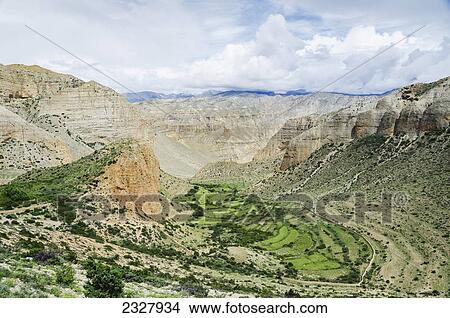 Picture - Incredible grassland between mountains along the way to samar; Upper mustang nepal. Fotosearch