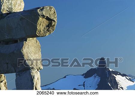 Inukshuk Statue At The Peak On Whistler Mountain, Whistler, Bc, Canada View Large Photo Image Stock Image - Inukshuk Statue At The Peak On Whistler Mountain, Whistler, Bc, Canada. Fotosearch