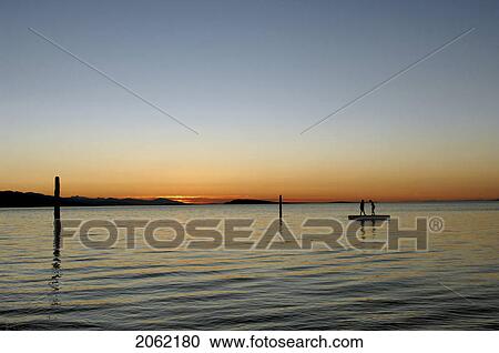 Kids In Silhouette On Dock Against Sunset, Vancouver Island, British Columba View Large Photo Image Stock Image - Kids In Silhouette On Dock Against Sunset, Vancouver Island, British Columba. Fotosearch