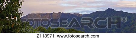 Stock Image - Landscape Of Mountains And Lush Vegetation At Sunset; Wailua Kauai Hawaii United States Of America. Fotosearch