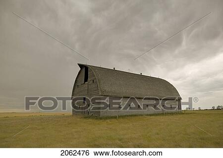 Stock Photograph - Large Unpainted Barn On The Prairies, Ceylon, Saskatchewan. Fotosearch