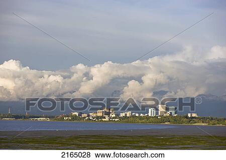Late Afternoon Light Shines Through Clouds Onto The Downtown Anchorage Skyline After A Thunderstorm, Southcentral Alaska, Summer View Large Photo Image Stock Photo - Late Afternoon Light Shines Through Clouds Onto The Downtown Anchorage Skyline After A Thunderstorm, Southcentral Alaska, Summer. Fotosearch