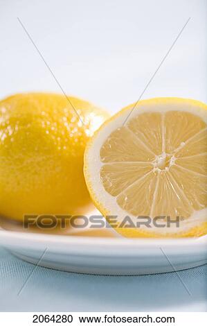 Lemon And Half Lemon On Plate View Large Photo Image Stock Image - Lemon And Half Lemon On Plate. Fotosearch