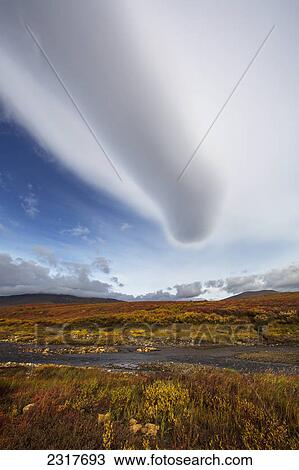 Stock Image - Lenticular Cloud Over The Tundra Along The Dempster Highway; Yukon Canada. Fotosearch