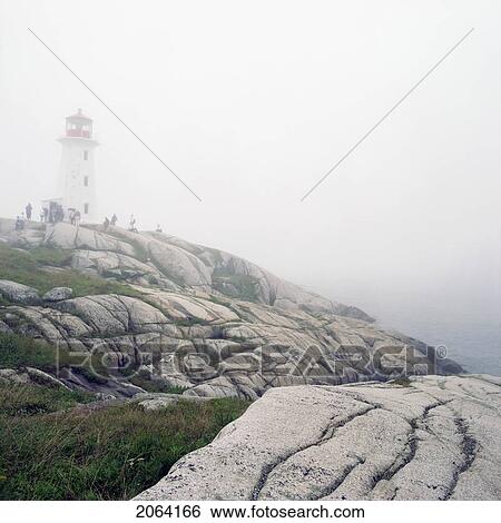 Stock Photograph - Lighthouse In Fog, Peggy's Cove, Nova Scotia.. Fotosearch