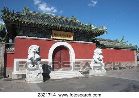Picture - Lion Statues Outside A Red Wall And Building With Chinese Architecture In The Hutong Area; Beijing China. Fotosearch