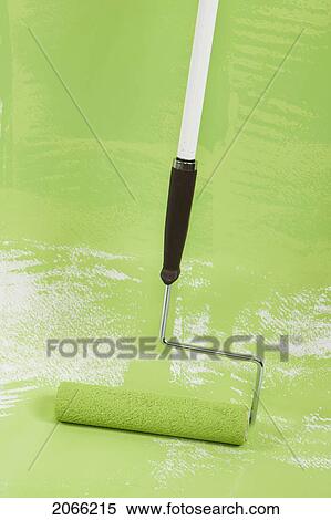 Stock Photography - Long-Handled Roller Painting Floor, Canada, British Columbia. Fotosearch