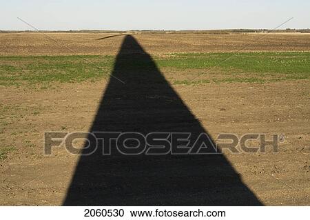 Long Shadow Of Wind Turbine On Ground View Large Photo Image Stock Image - Long Shadow Of Wind Turbine On Ground. Fotosearch