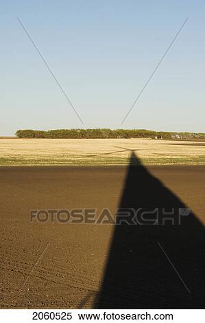 Long Shadow Of Wind Turbine On Ground View Large Photo Image Stock Photography - Long Shadow Of Wind Turbine On Ground. Fotosearch