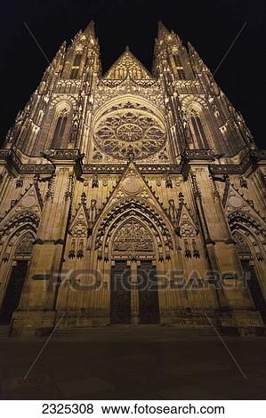 Low angle view of a church with an ornate facade illuminated at night; Prague czech republic View Large Photo Image Stock Photo - Low angle view of a church with an ornate facade illuminated at night; Prague czech republic. Fotosearch