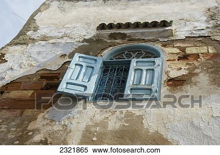 Low Angle View Of An Open Shutter On A Window On A Weathered And Worn Wall In Old Medina; Casablanca Morocco View Large Photo Image Stock Photography - Low Angle View Of An Open Shutter On A Window On A Weathered And Worn Wall In Old Medina; Casablanca Morocco. Fotosearch