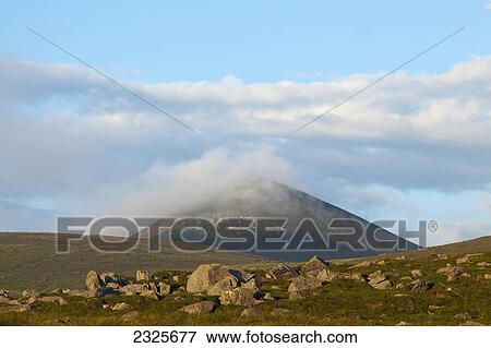 Low cloud covering a hilltop; County kerry ireland View Large Photo Image Stock Photo - Low cloud covering a hilltop; County kerry ireland. Fotosearch