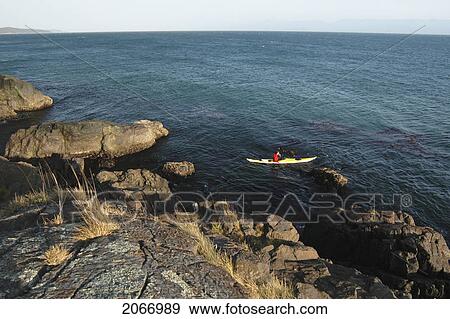 Man Kayaking Off Rocky Shoreline, Sheringham Point Lighthouse, Sooke, Bc, Canada View Large Photo Image Stock Photo - Man Kayaking Off Rocky Shoreline, Sheringham Point Lighthouse, Sooke, Bc, Canada. Fotosearch