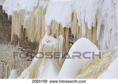 Massive Icicles Hang From Alexandra Falls, Located Near The Alberat-Northwest Territories Border In Early March. View Large Photo Image Stock Photo - Massive Icicles Hang From Alexandra Falls, Located Near The Alberat-Northwest Territories Border In Early March.. Fotosearch