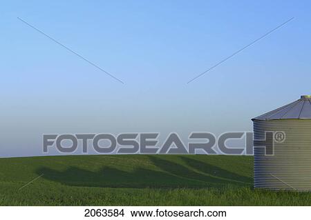 Metal Grainery And Shadow; Canada, Manitoba, Erickson View Large Photo Image Picture - Metal Grainery And Shadow; Canada, Manitoba, Erickson. Fotosearch