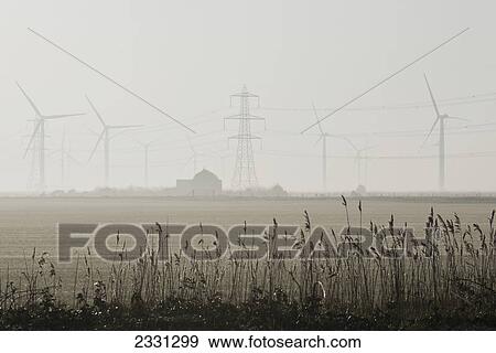 Misty morning at the little cheyne court wind farm at romney marsh; Kent east sussex england View Large Photo Image Stock Photo - Misty morning at the little cheyne court wind farm at romney marsh; Kent east sussex england. Fotosearch