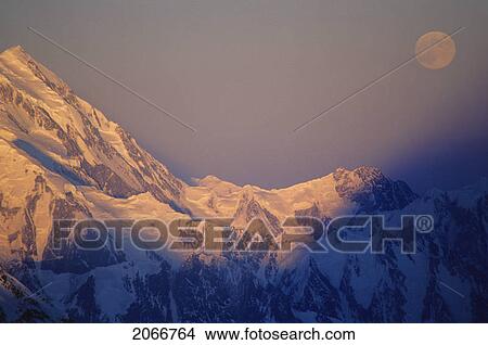 Moon Over Ridge Of Mt Vancouver With The Shadow Of Mt. Logan View Large Photo Image Picture - Moon Over Ridge Of Mt Vancouver With The Shadow Of Mt. Logan. Fotosearch