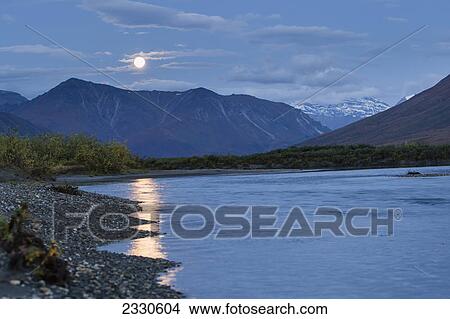 Picture - Moonlight reflected into noatak river in the brooks range gates of the arctic national park northwestern alaska; Alaska united states of america. Fotosearch
