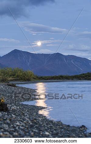 Stock Image - Moonlight reflected into noatak river in the brooks range gates of the arctic national park northwestern alaska; Alaska united states of america. Fotosearch
