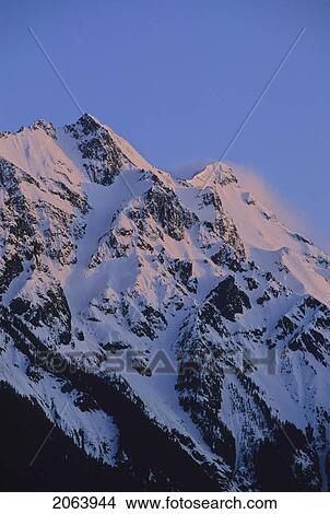 Mount Currie Rises Above Pemberton Valley, Alpenglow Lights Snow, Pemberton, Bc Canada View Large Photo Image Picture - Mount Currie Rises Above Pemberton Valley, Alpenglow Lights Snow, Pemberton, Bc Canada. Fotosearch