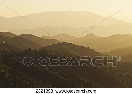 Stock Image - Mountain Landscape At Sunrise In Montes De Malaga Near Almogia; Malaga Province Andalusia Spain. Fotosearch