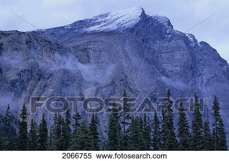 Stock Photography - Mountain Ridge With Cloud Cover And Snow Patched, Athabasca Pass, Jasper National Park. Fotosearch