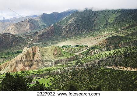 Stock Image - Mountainous landscape and roads to the capital of nepalese upper mustang kingdom lo manthang; Upper mustang nepal. Fotosearch