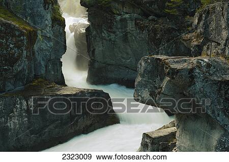 Stock Photo - Nairn falls snakes through rough stone cliffs at nairn falls provincial park; British columbia canada. Fotosearch