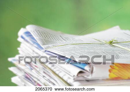 Stock Image - Newspapers Tied Into A Pile For The Recycle Bin.. Fotosearch