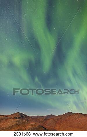 Stock Photo - Northern lights above eagle summit along the steese highway north of fairbanks pinnell mountain range; Alaska united states of america. Fotosearch