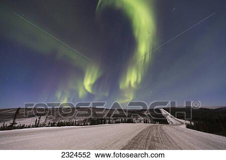 Northern lights dancing over the james dalton highway in winter north of fairbanks; Alaska united states of america View Large Photo Image Stock Image - Northern lights dancing over the james dalton highway in winter north of fairbanks; Alaska united states of america. Fotosearch