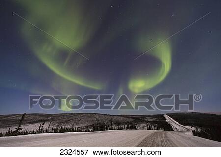 Northern lights dancing over the james dalton highway in winter north of fairbanks; Alaska united states of america View Large Photo Image Stock Photo - Northern lights dancing over the james dalton highway in winter north of fairbanks; Alaska united states of america. Fotosearch