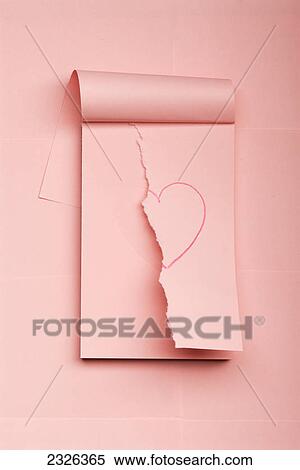 Stock Photography - Notepad with drawn heart ripped in half. Fotosearch