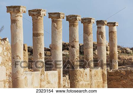 Old columns in a row against a blue sky; Paphos cyprus View Large Photo Image Picture - Old columns in a row against a blue sky; Paphos cyprus. Fotosearch