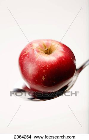 Picture - Organic Apple In Spoon. Fotosearch