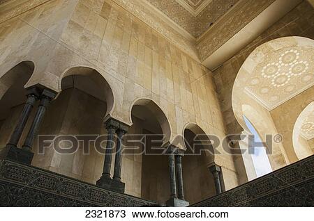 Stock Image - Ornate Facade On Walls With Arches And Pillars In Hassan Ii Mosque; Casablanca Morocco. Fotosearch