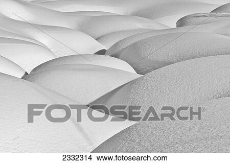 Patterns of shadow and shape created by deep snow over the Little Susitna River in Hatcher Pass in Southcentral Alaska. Afternoon. Winter. View Large Photo Image Picture - Patterns of shadow and shape created by deep snow over the Little Susitna River in Hatcher Pass in Southcentral Alaska. Afternoon. Winter.. Fotosearch