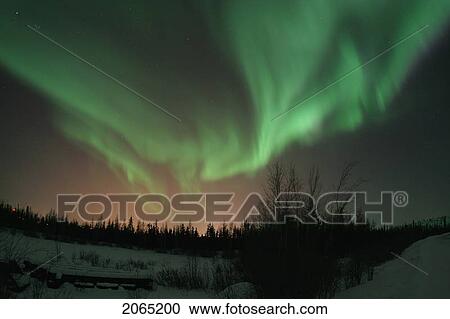 Photographed On The Road To Dettah Outside Of Yellowknife, Northwest Territories; This Can Be Considered An Explosion Of Aurora Borealis. The Reddish Hue Is Ambient Light Coming From The City Of Yellowknife. View Large Photo Image Stock Image - Photographed On The Road To Dettah Outside Of Yellowknife, Northwest Territories; This Can Be Considered An Explosion Of Aurora Borealis. The Reddish Hue Is Ambient Light Coming From The City Of Yellowknife.. Fotosearch