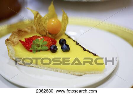 Stock Image - Piece Of Lemon Fruit Flan Dessert On White Plate. Fotosearch