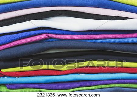 Stock Photograph - Pile Of Different Coloured T-Shirts For Sale In Clothing Shop; Konya Konya Province Turkey. Fotosearch