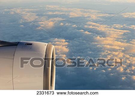 Plane flying over clouds View Large Photo Image Stock Image - Plane flying over clouds. Fotosearch